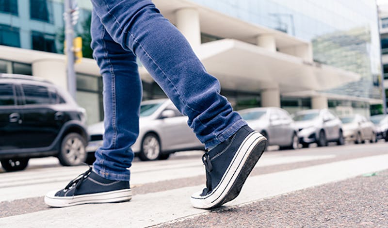 Person walking on a crosswalk