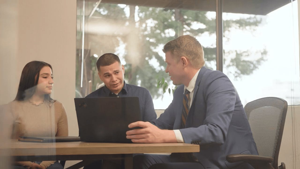 Attorney Ben Swanson talking to clients