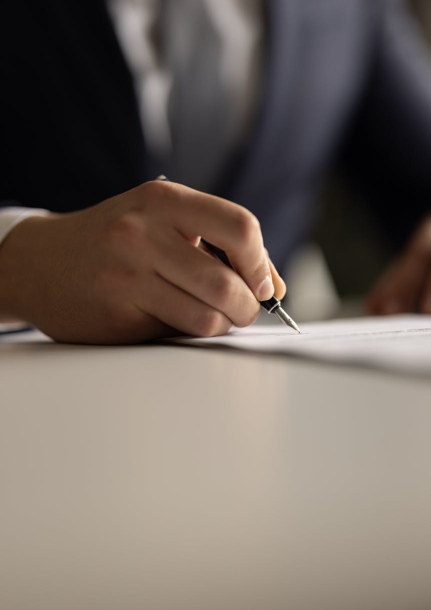 A man signing a document