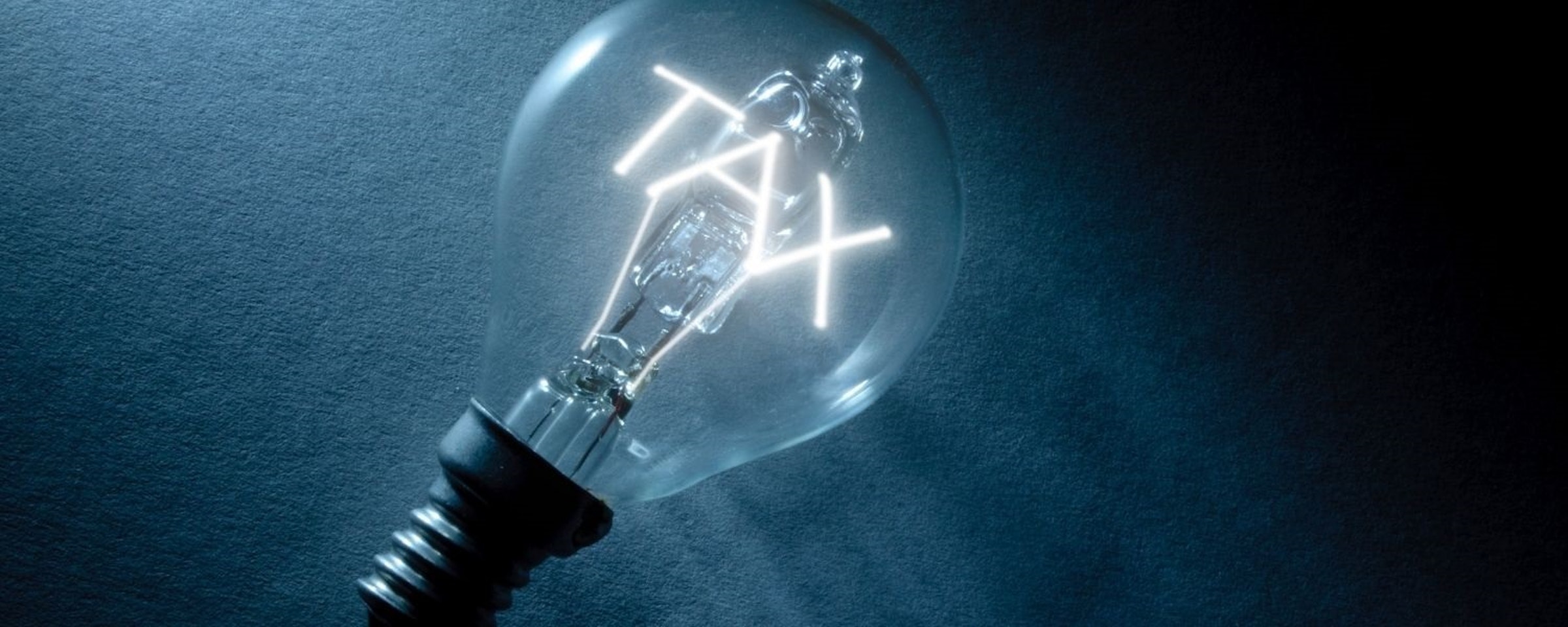 Tax Lightbulb Tax written in a lightbulb