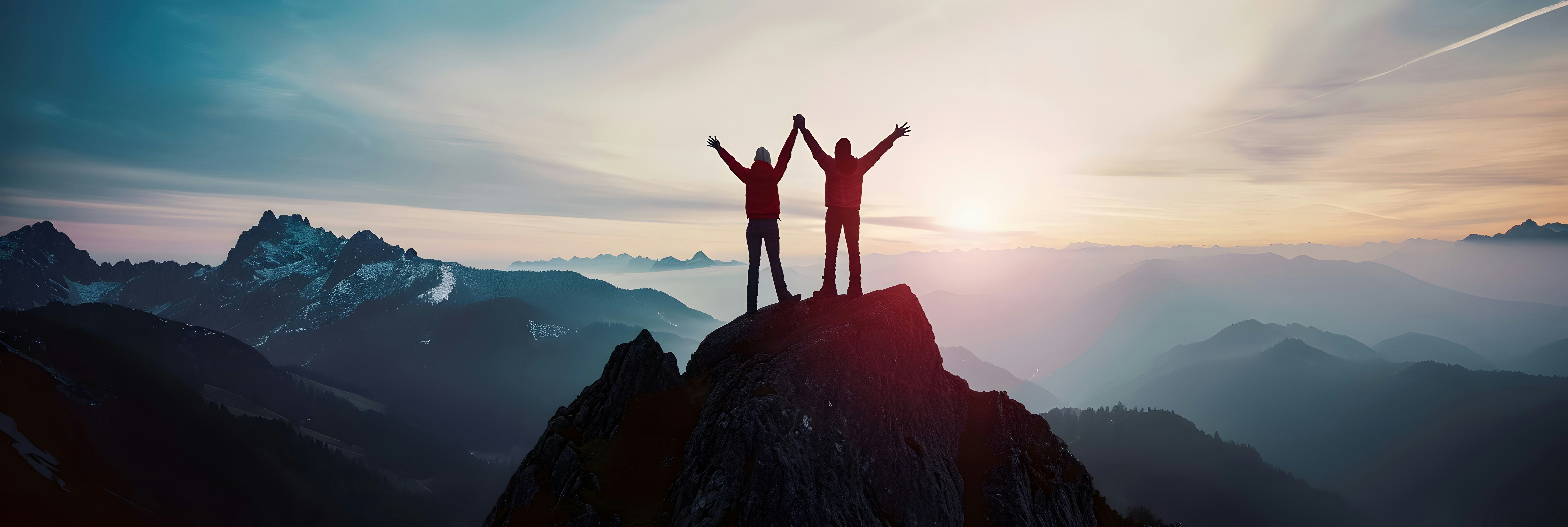 Together overcoming obstacles with people holding hands up in the air on mountain top , celebrating success and achievements