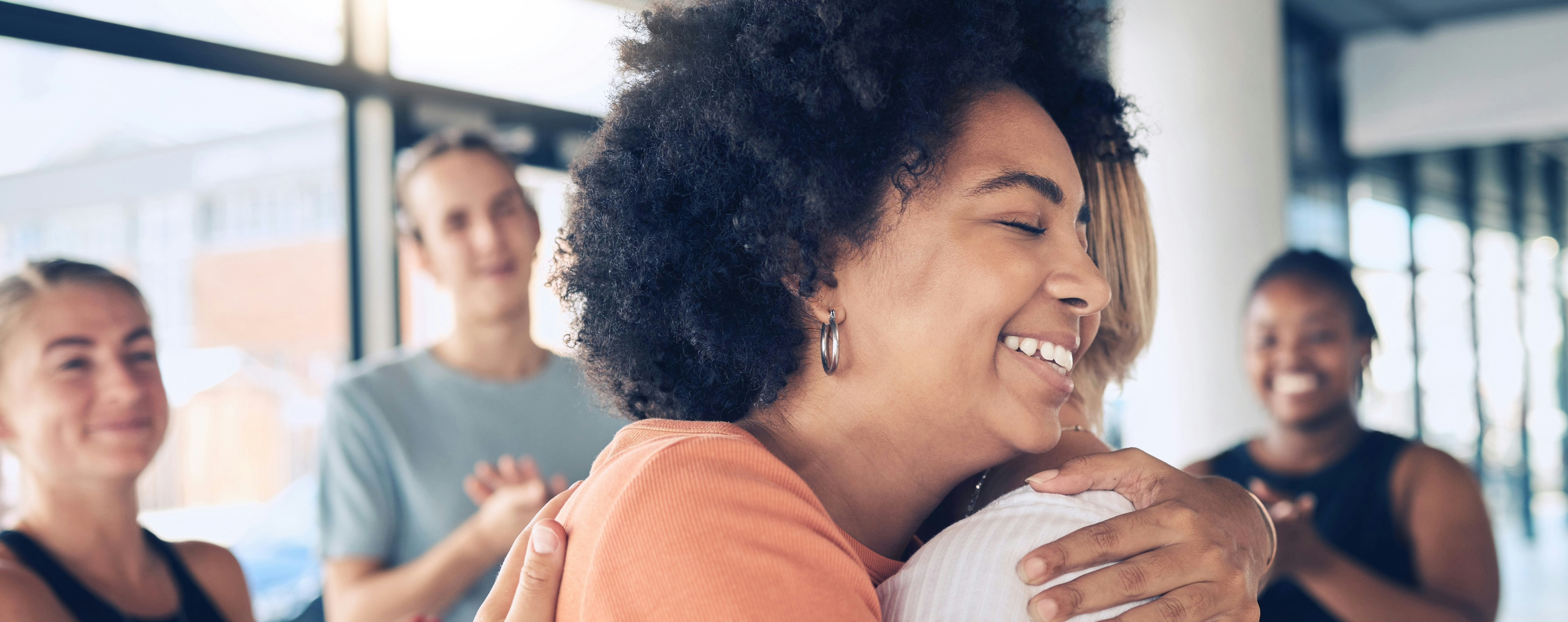 Women hugging at work