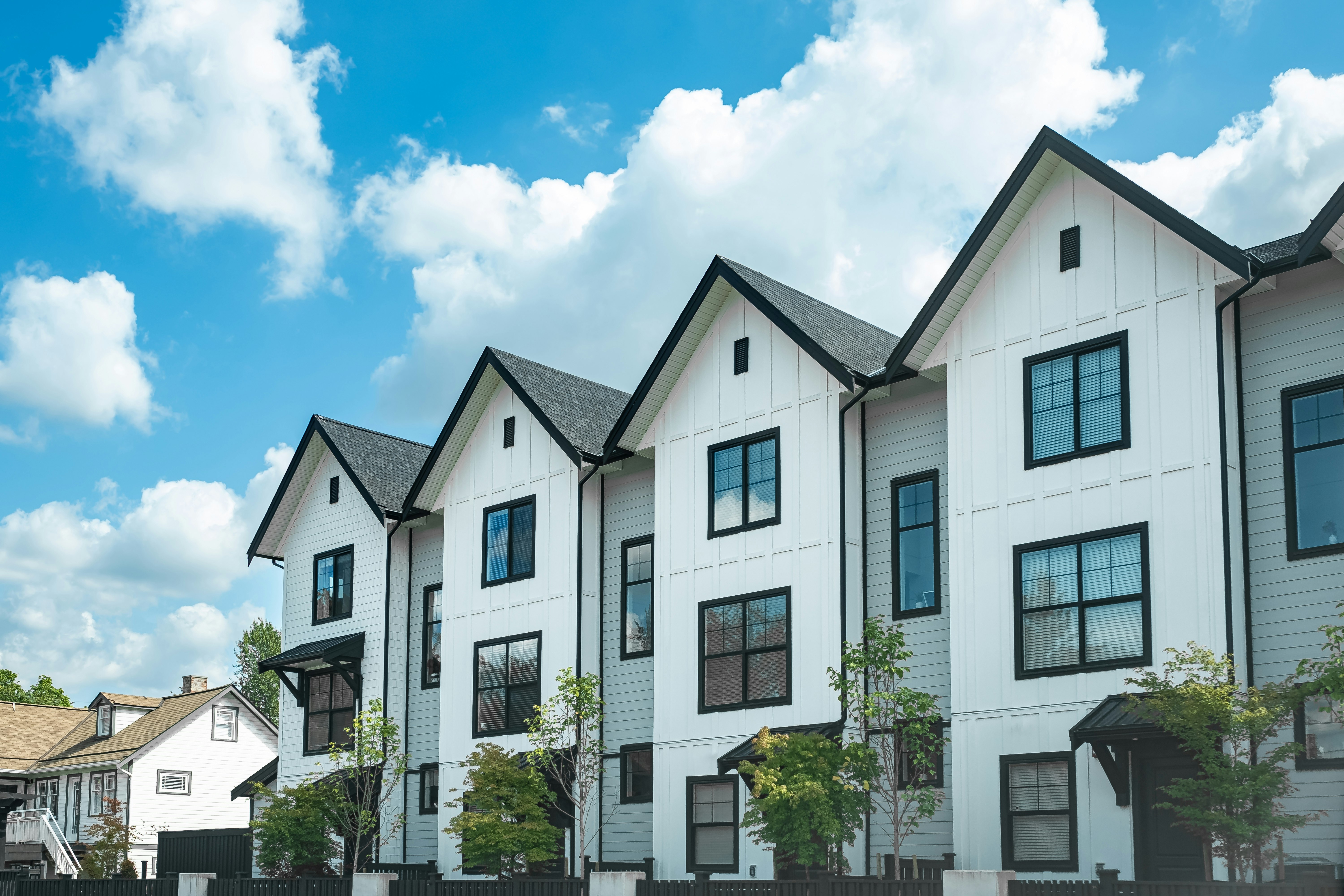 Brand new apartment building on sunny day in BC, Canada. Canadian modern residential architecture.
