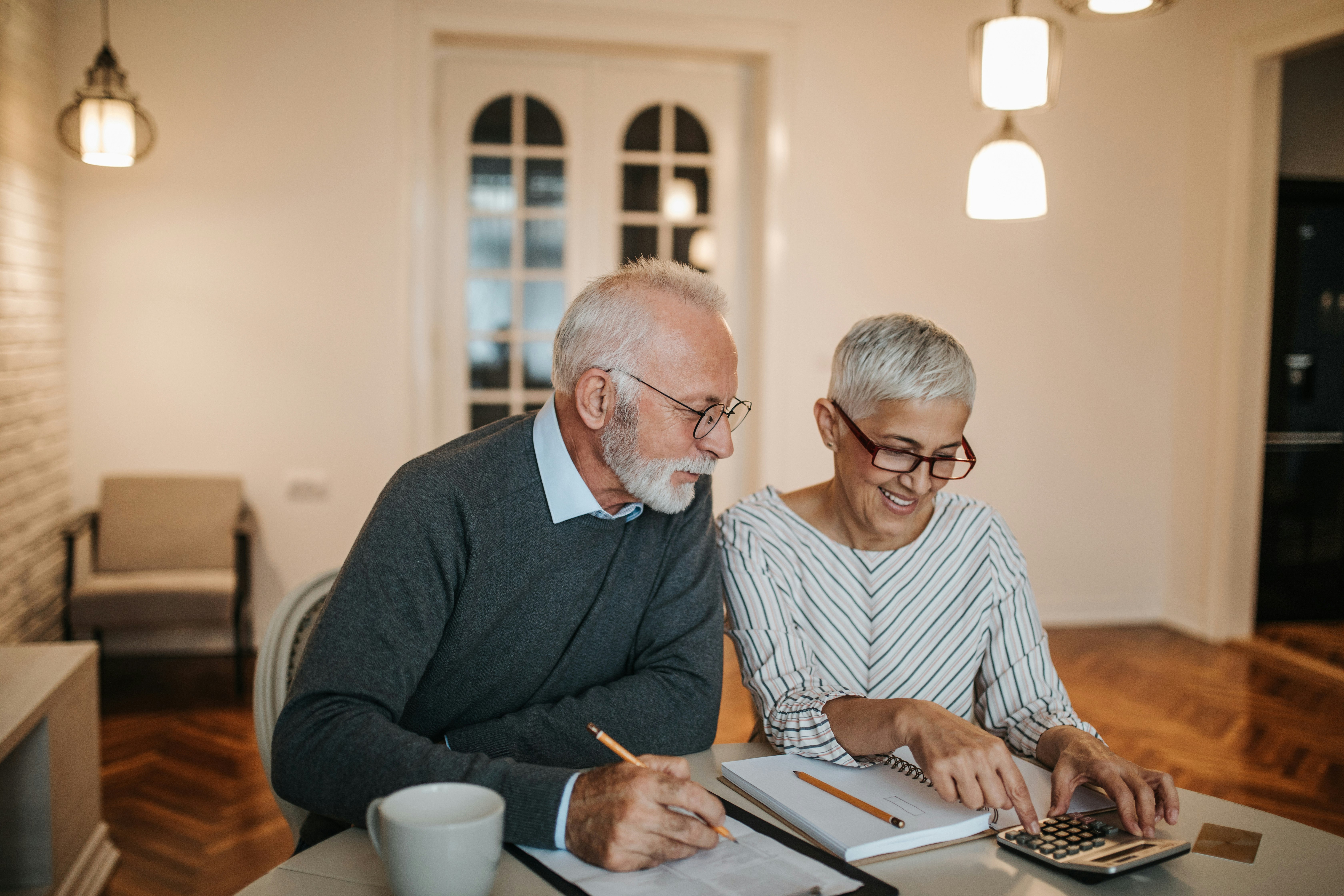 Retired Couple Financial Planning Two retirees plan their retirement and RRSPs.