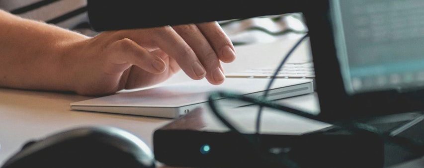 Hands writing on keyboard