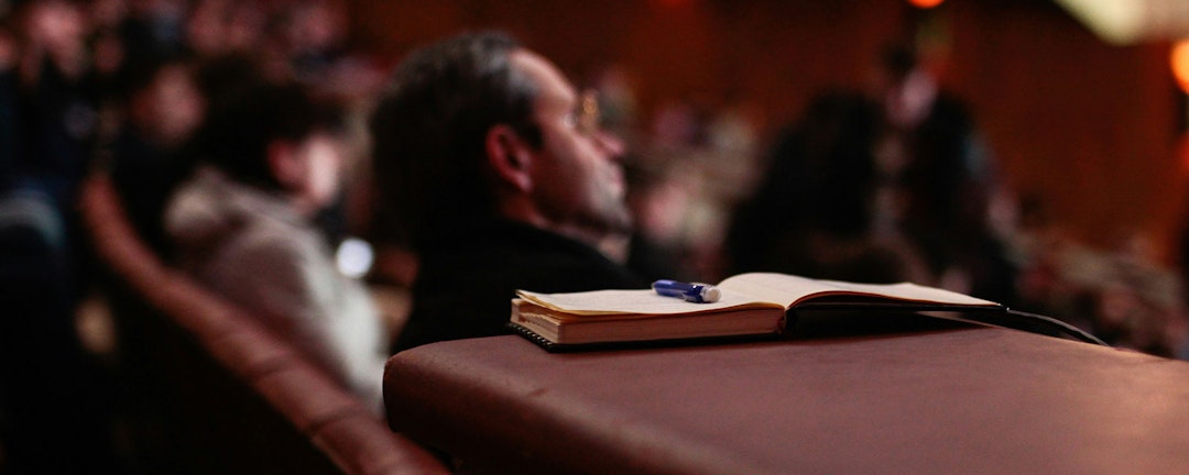 Person listening to speaker
