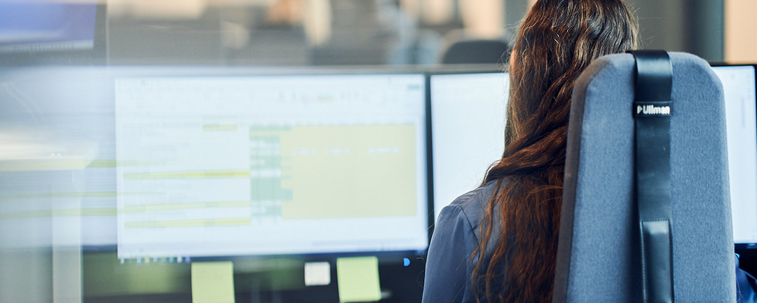 Woman in front of work station