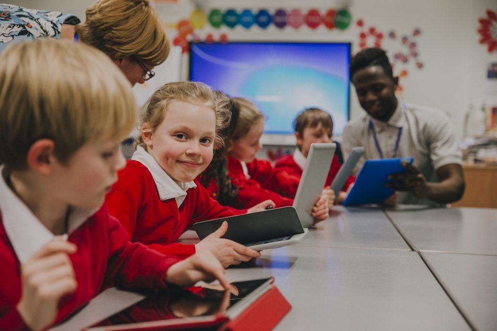 Image shows primary school children in the classroom. Image from Getty Images