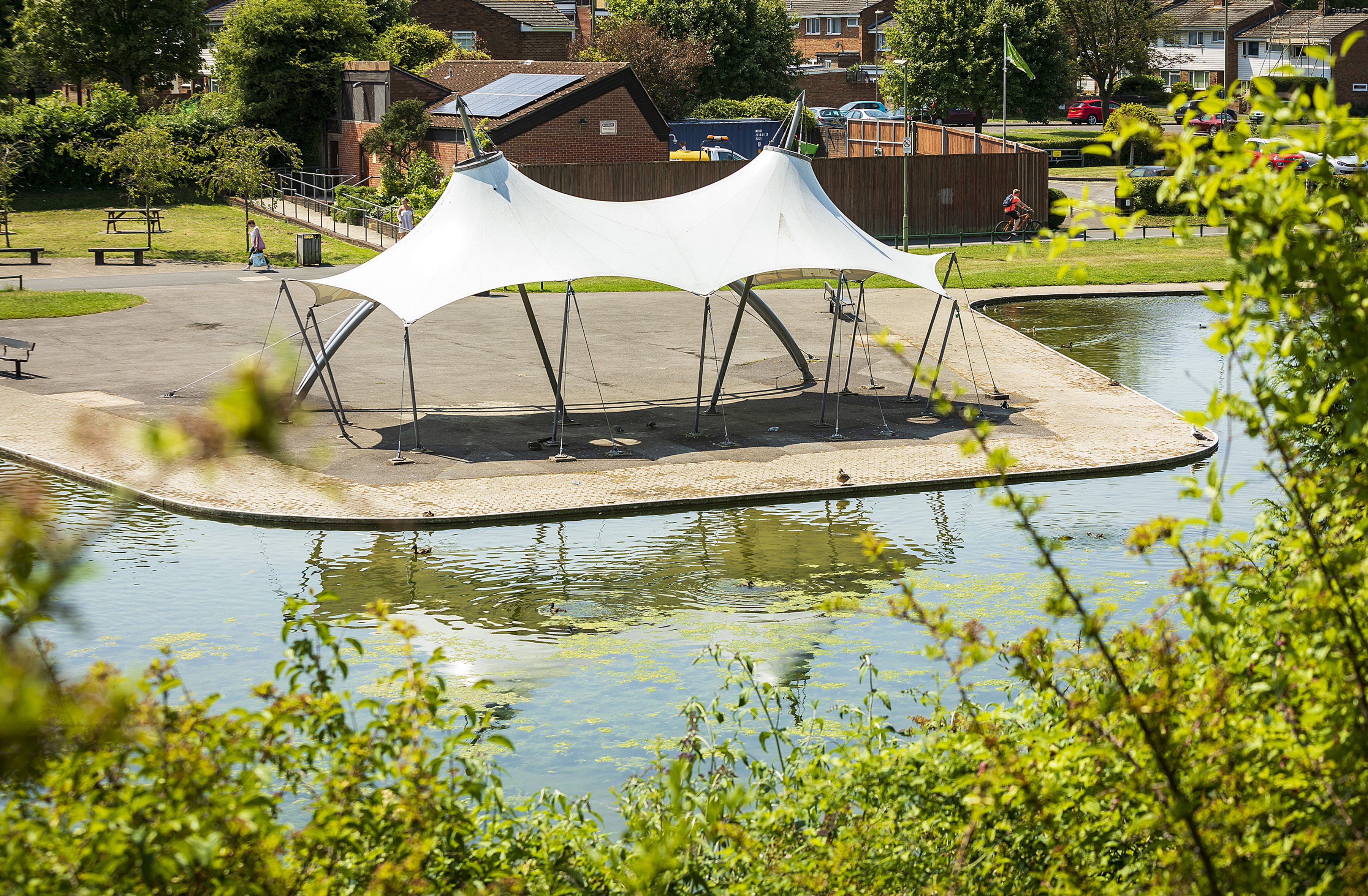 The bandstand from above. In front of the banstand is the boating lake, in which you can see the reflection of the bandstand.