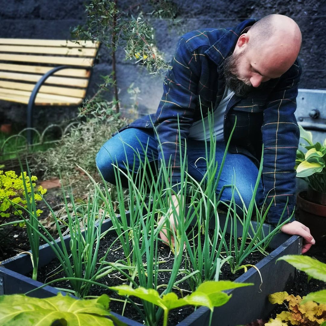 The Beardy Gardener in action, planting flowers