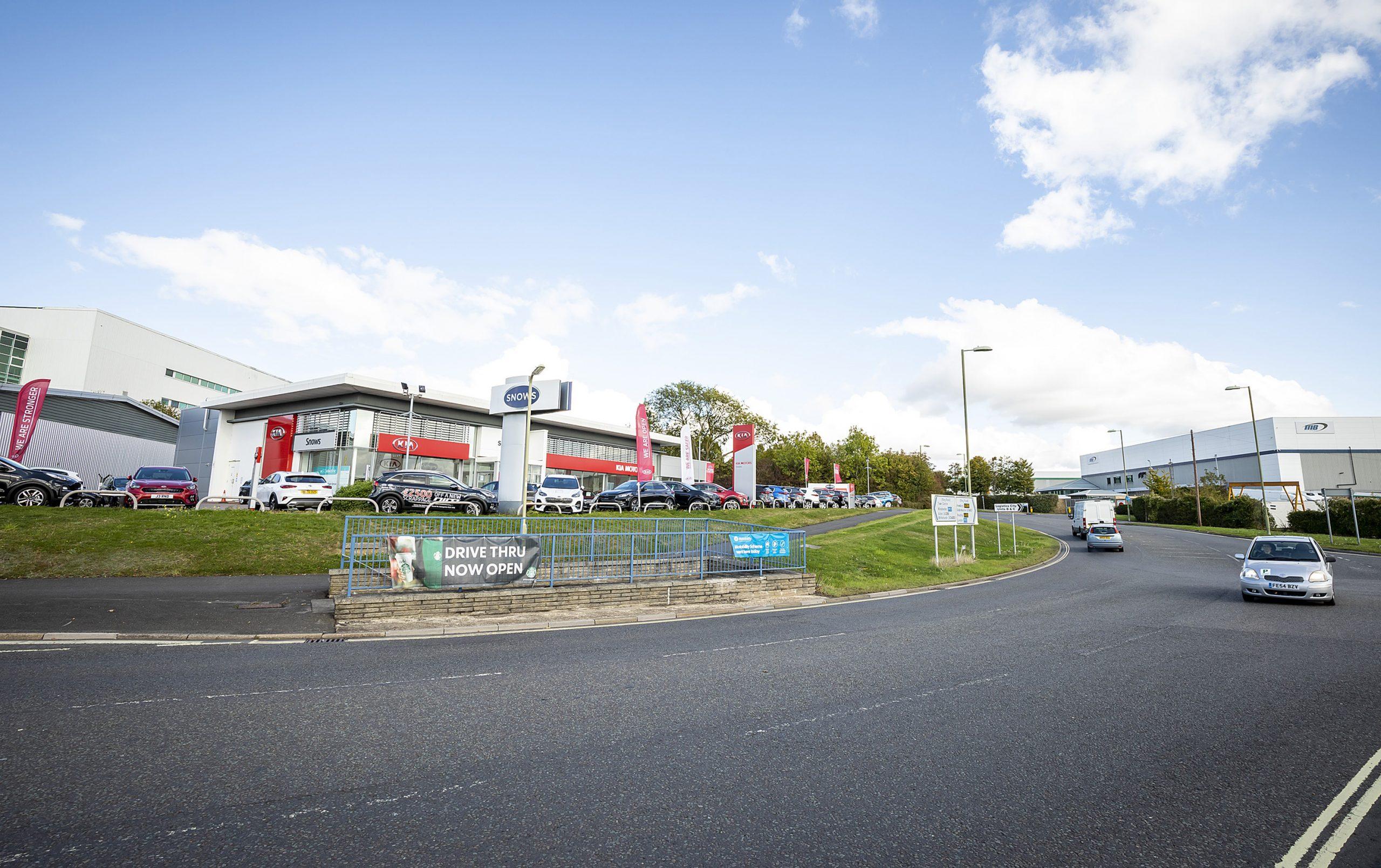 road with garage in the background