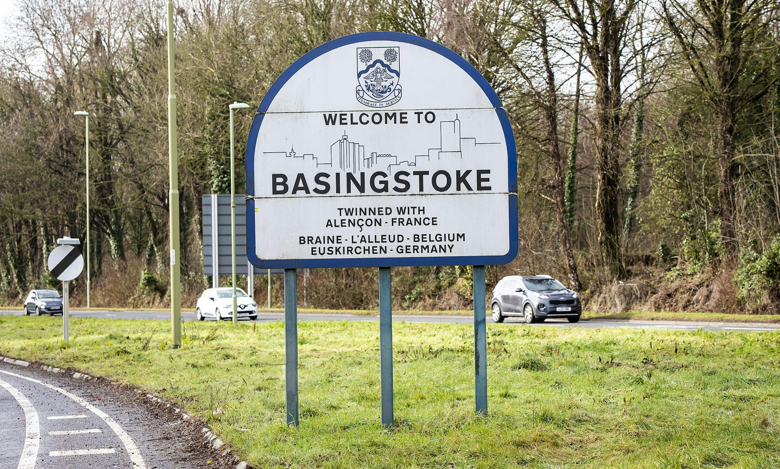 A road sign saying welcome to Basingstoke.