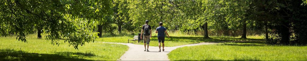 Two people walking in glebe gardens