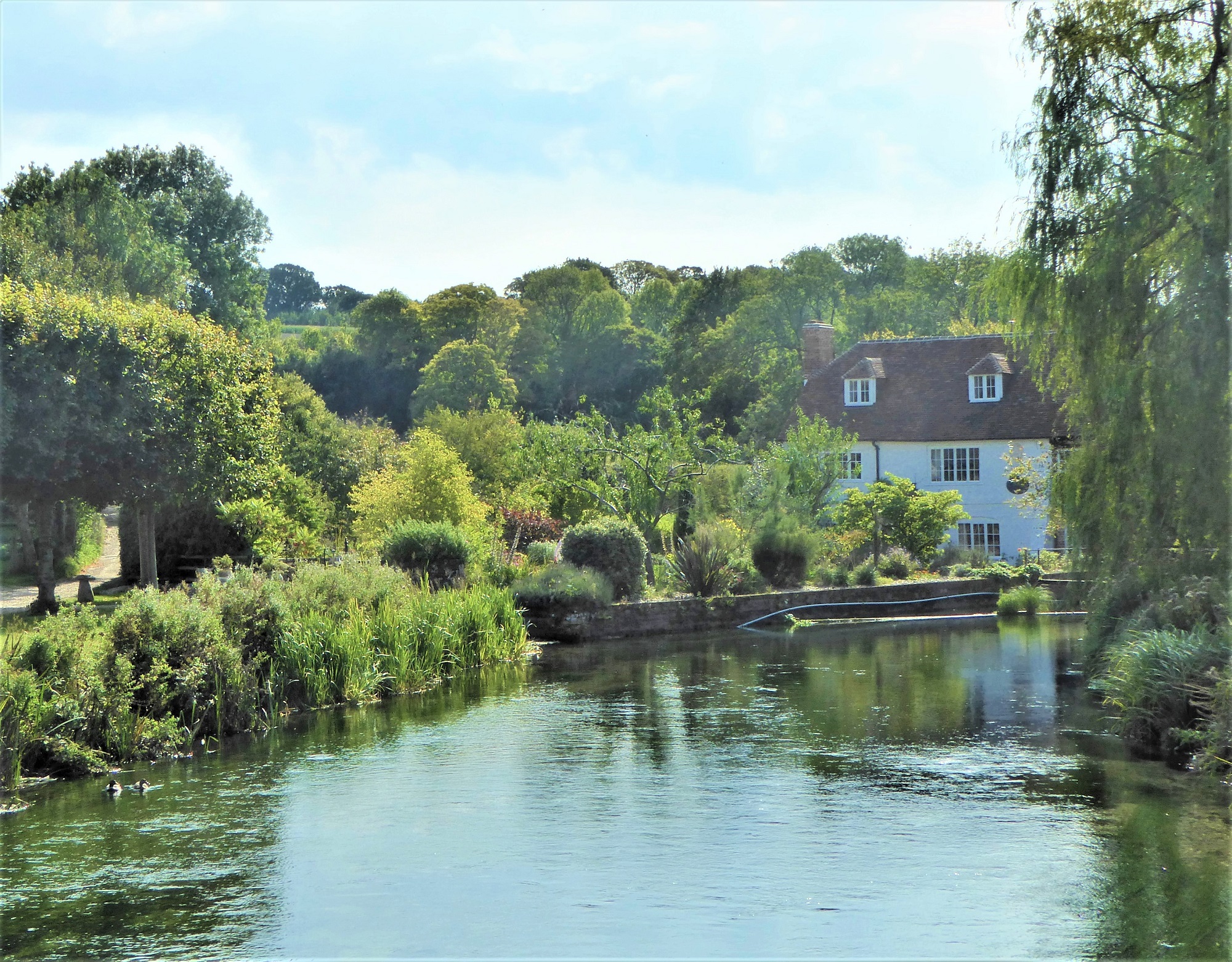 A photograph of bere Mill alongside the river Test