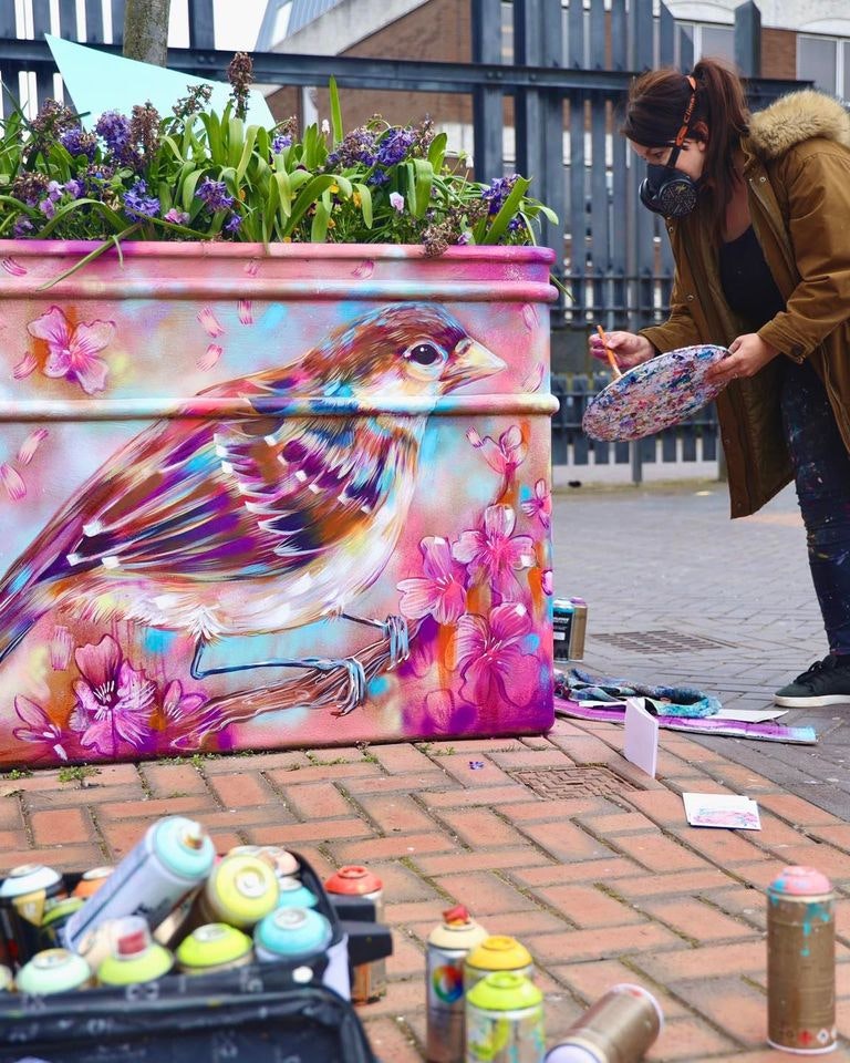 Sian Storey Art painiting a planter at London Street