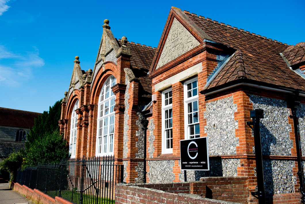 A stone and red brick victorian style building.