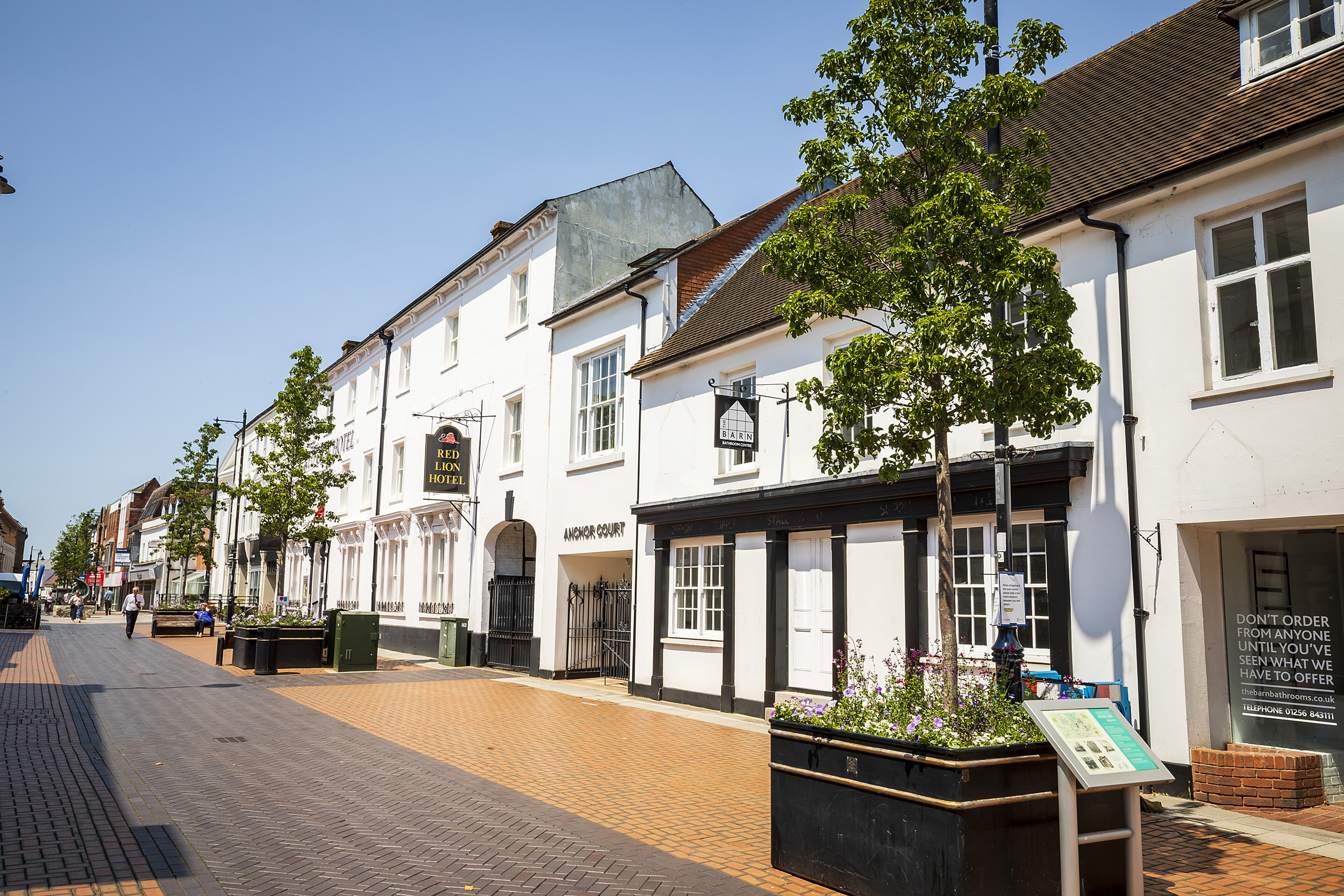 The white buildings of the Red Lion Hotel and next door buildings.