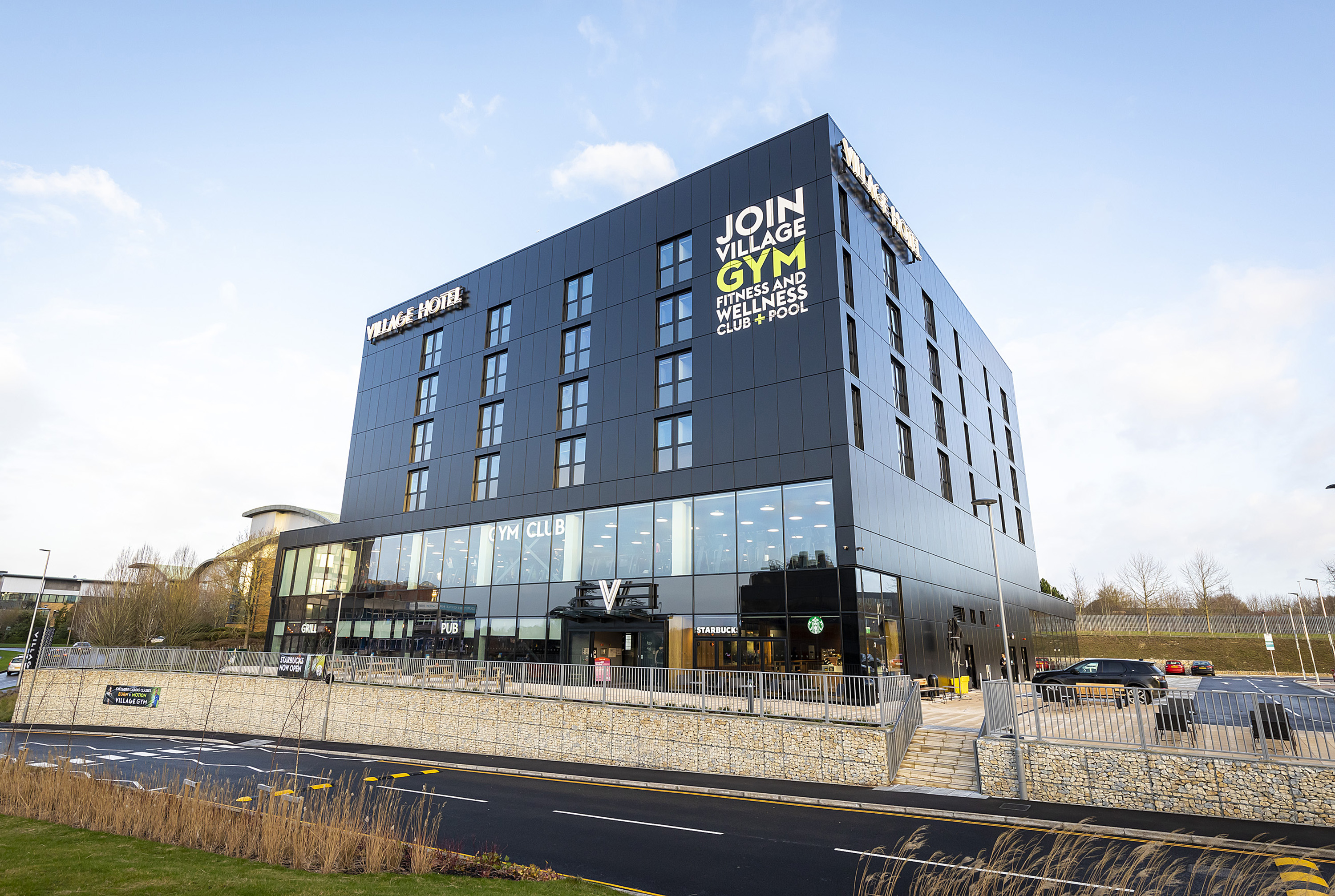 A two storey glassed area with another four storeys of hotel above. The ground floor you can see the Grill and Starbucks. Above this is the Gym club..