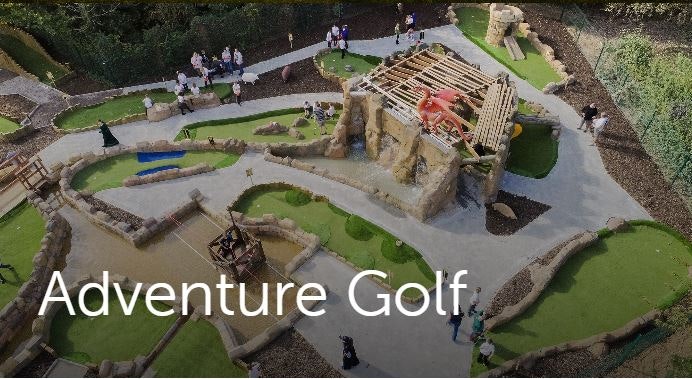 An image from the air of the adventure golf. You can see people taking part and a number of different holes.