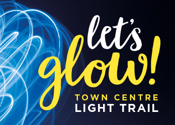 A blue background with the words Let's Glow! Town Centre Light Trail.