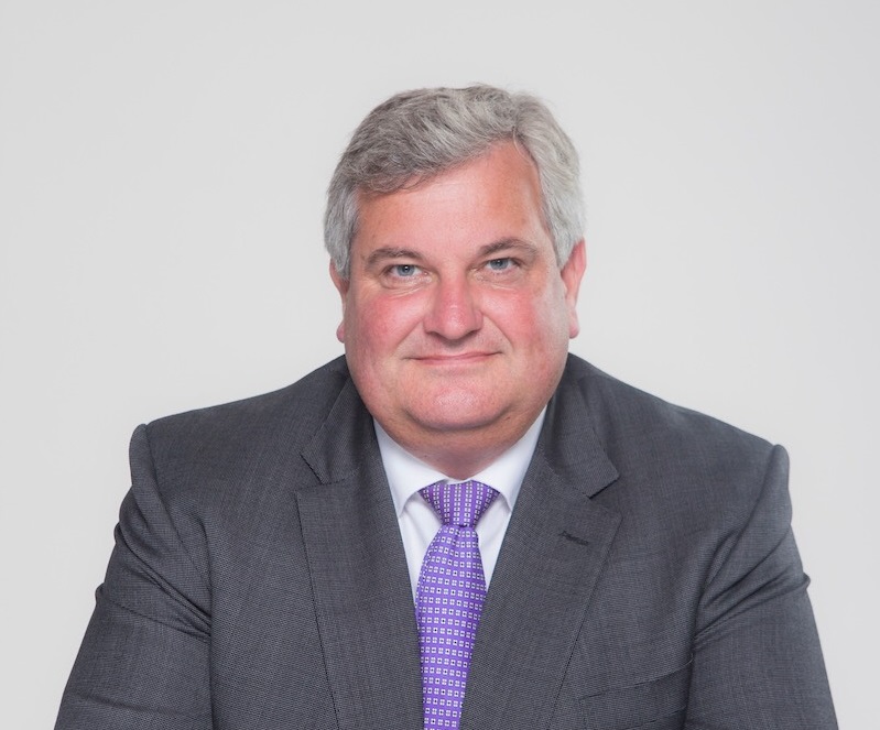 A male wears a suit.