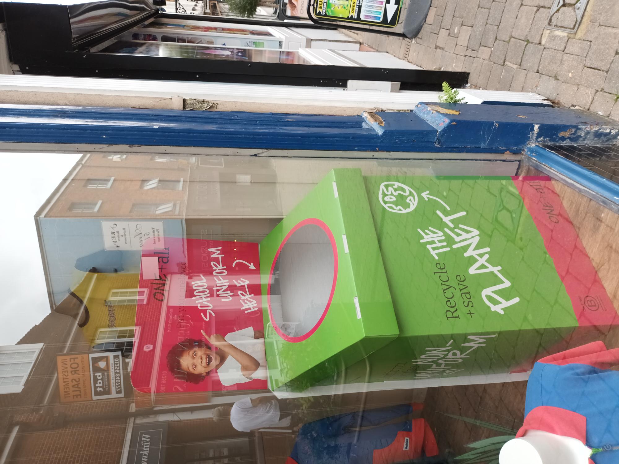 A red and green box for recycling old school uniform