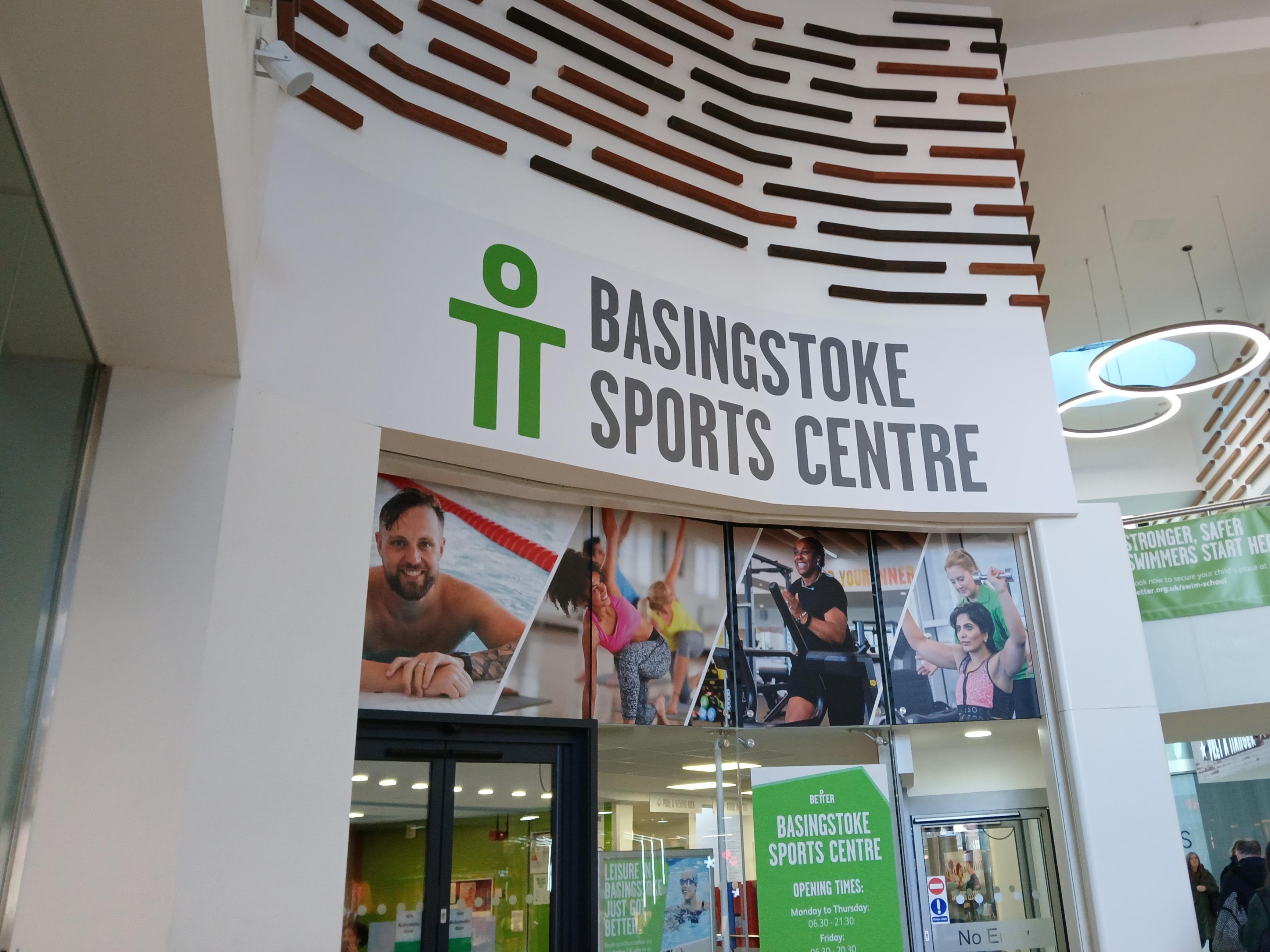 A white sign with basingstoke sports centre.