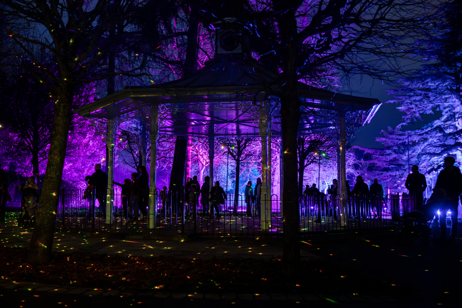 A photograph taken at night of the War Memorial Park bandstand at the Let's Glow light up trail event
