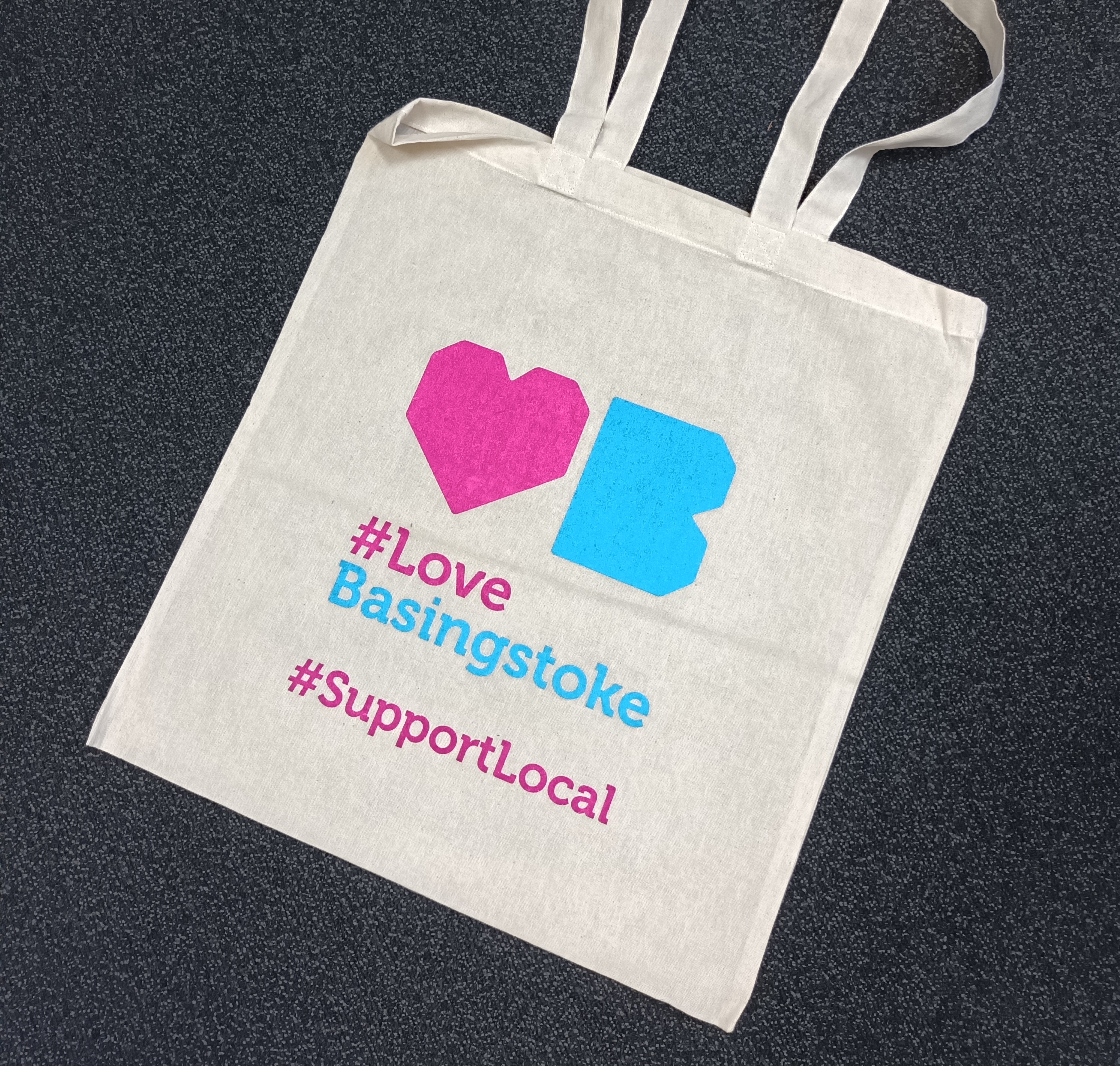 A tote bag with the Love Basingstoke logo on and #SupportLocal