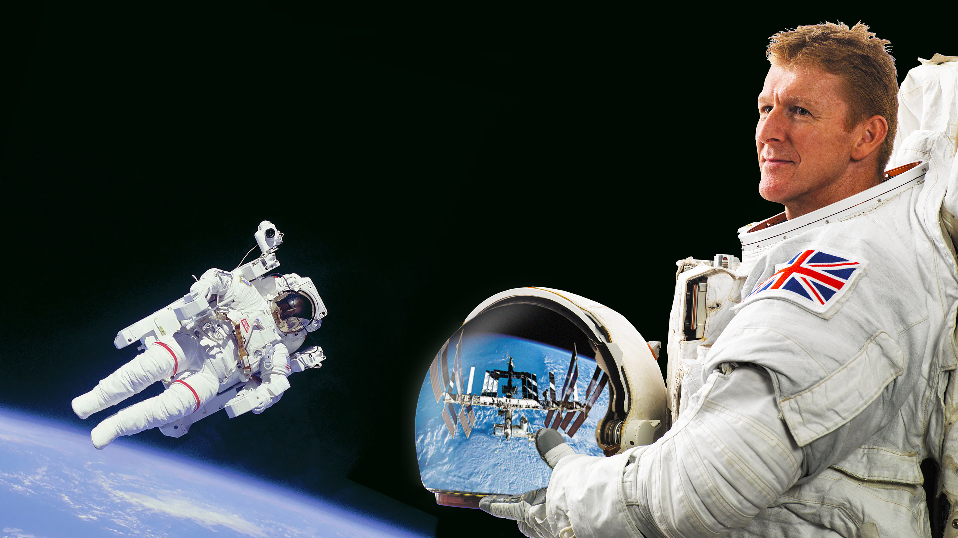 A man is wearing an astronauts costume and staring into space