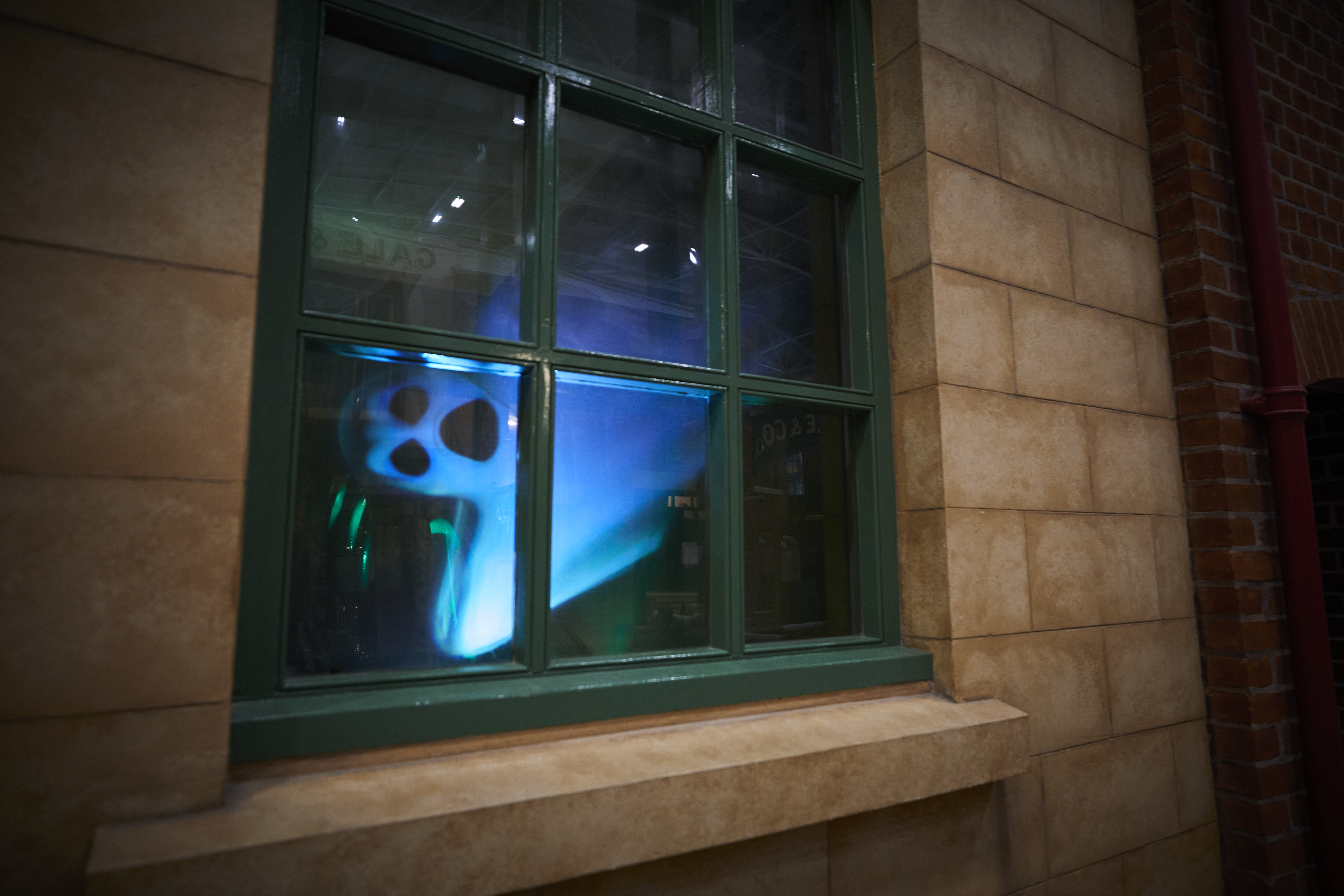 A green window with a ghost in it.