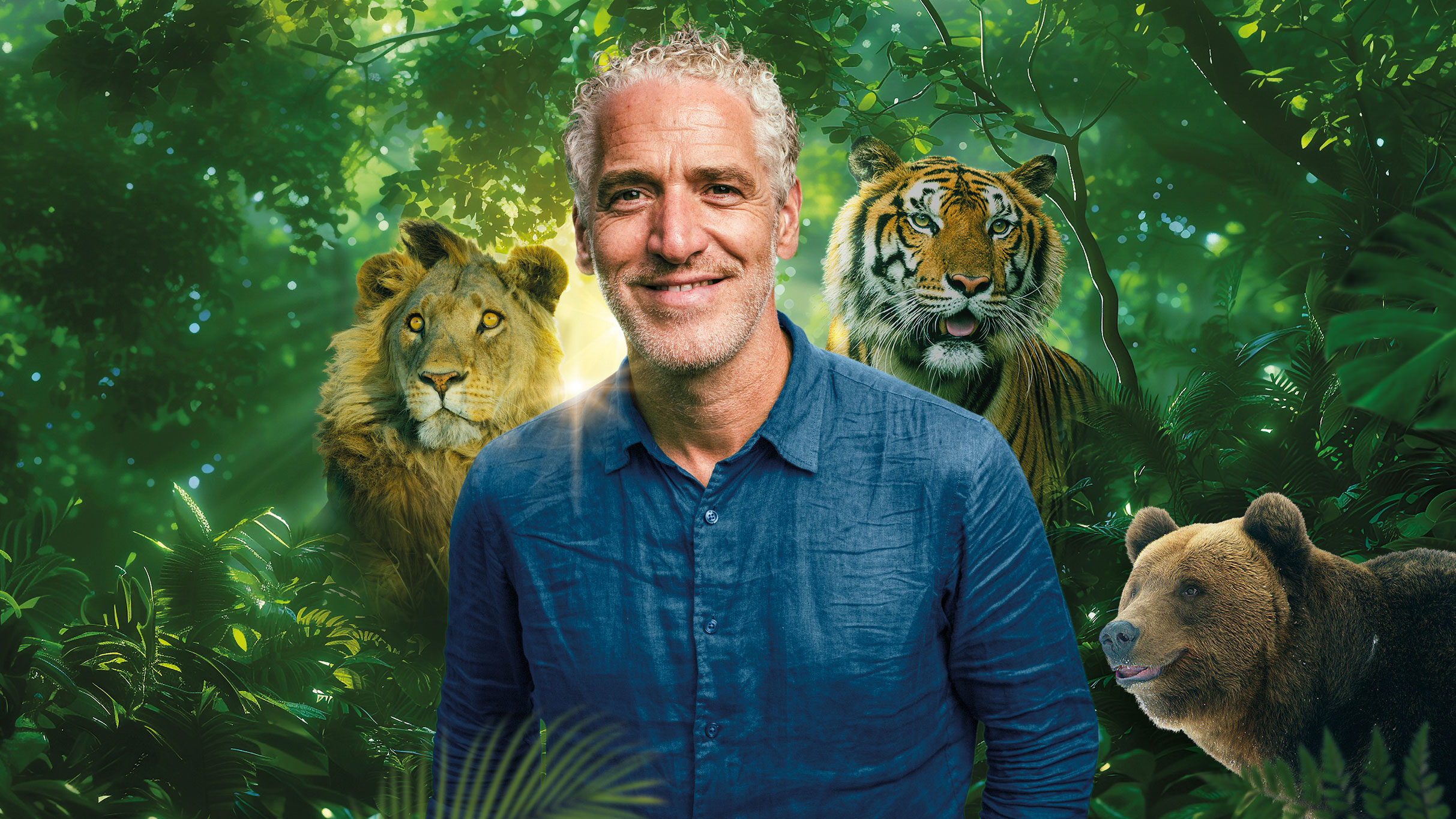 Gordon Buchanan image with a lion, tiger and bear around him and greenery.