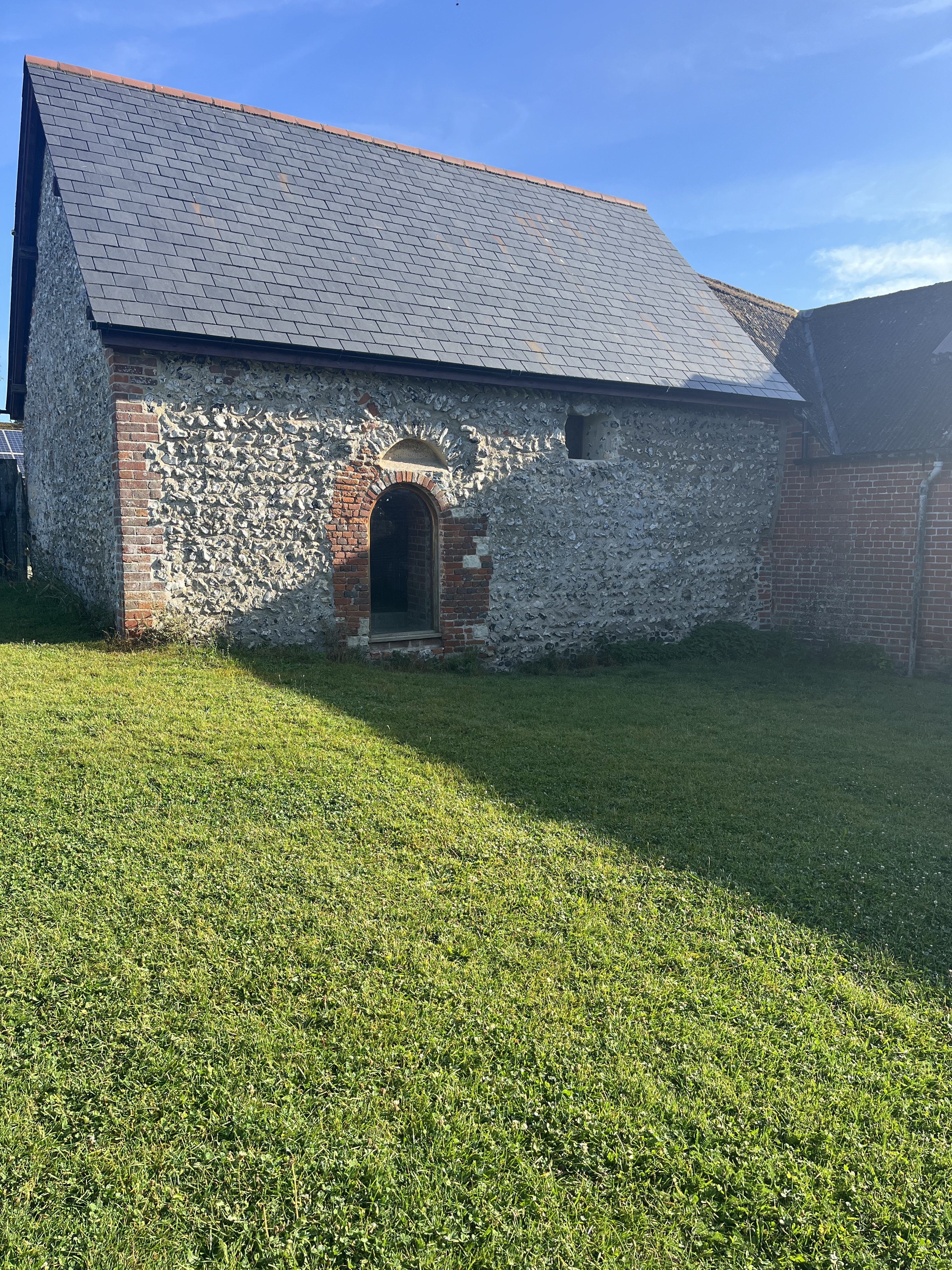 A photograph of a historic chapel made from grey stone.