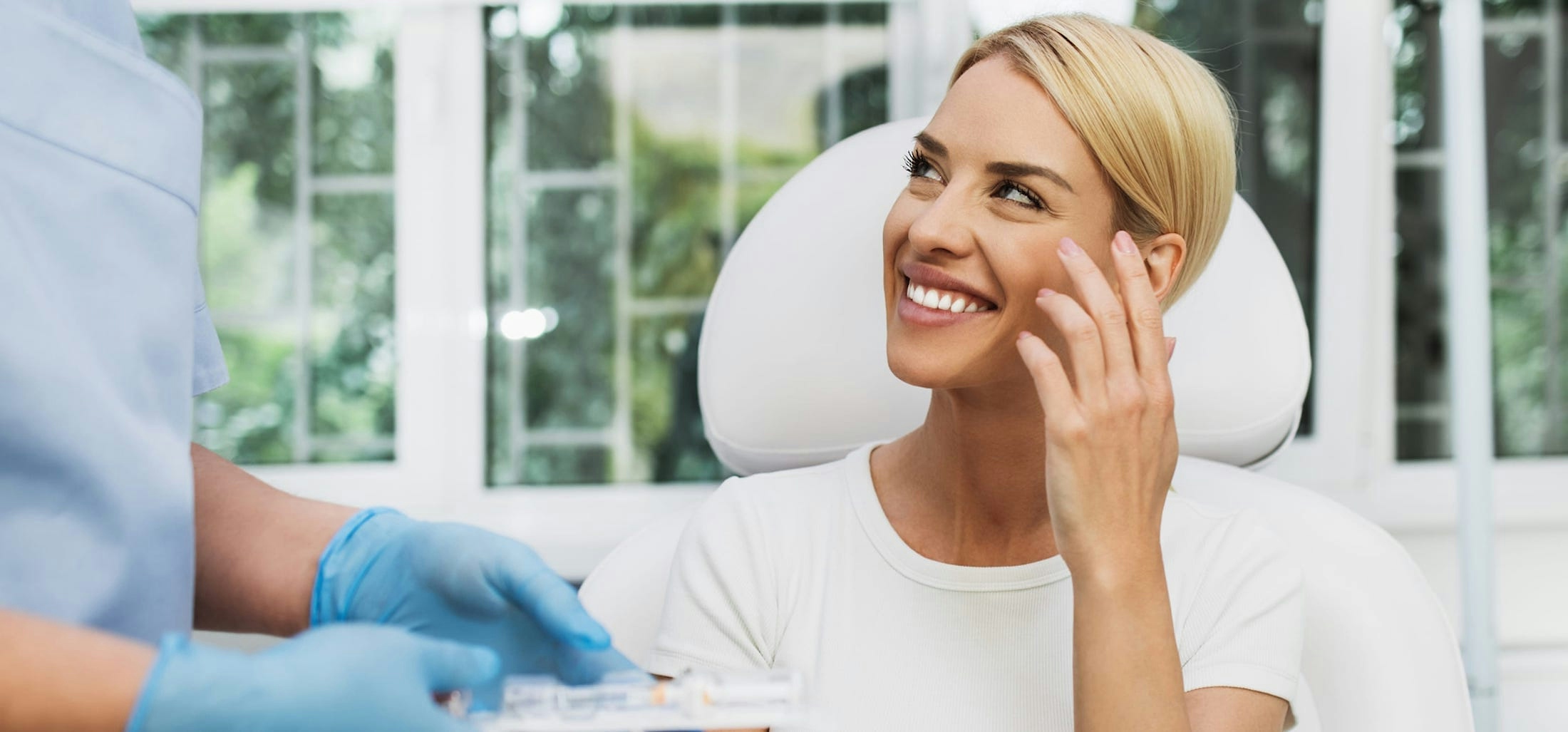 Woman smiling with physician