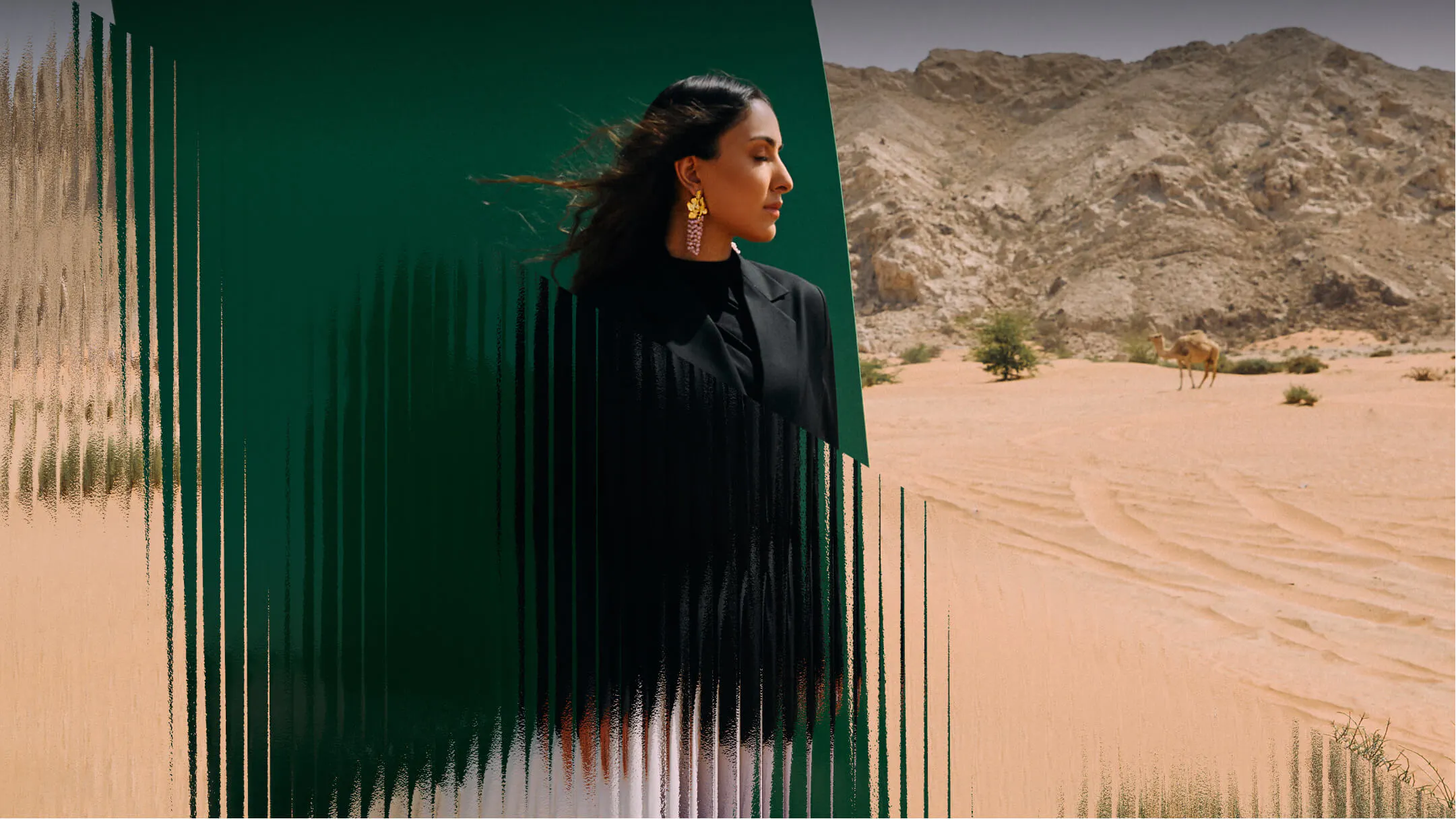 Woman in dessert with green structure - Maison Pyramide