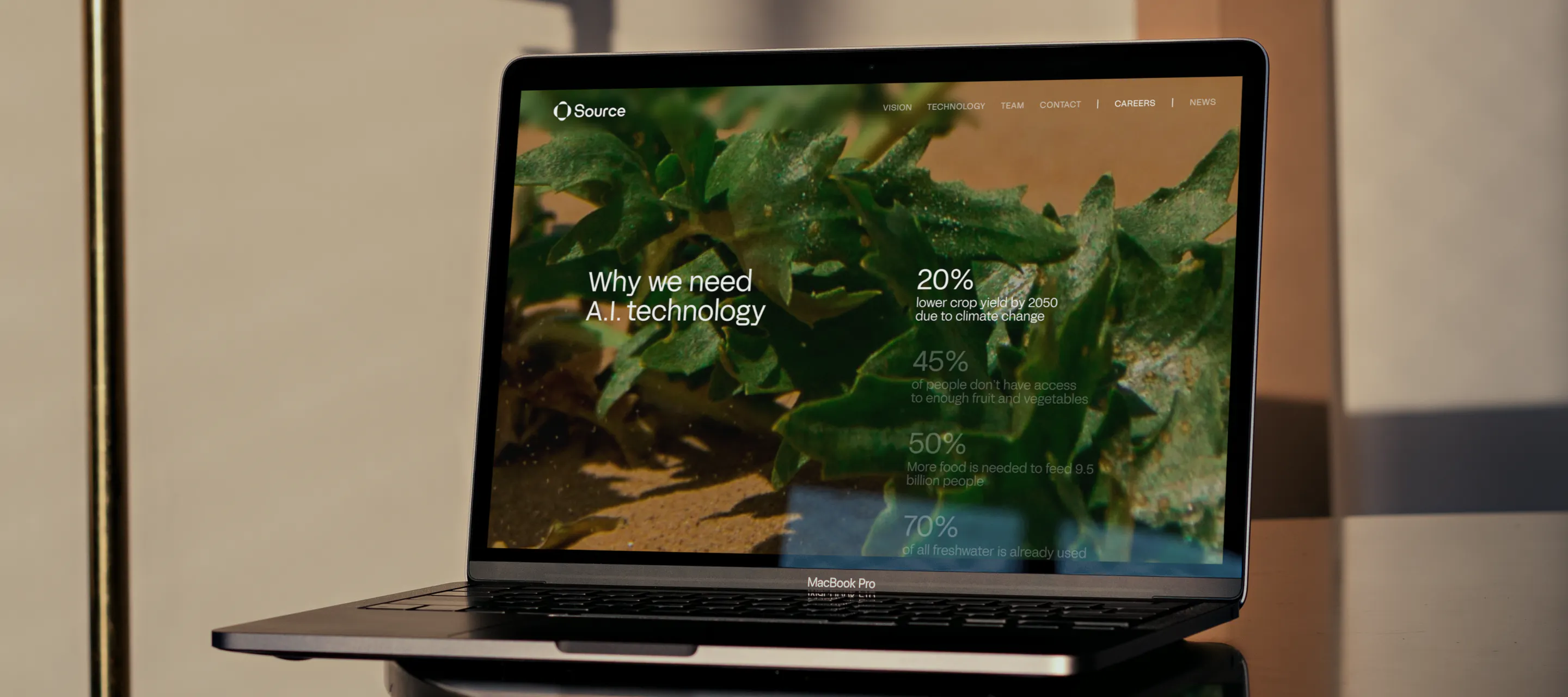 Project content on laptop screen - Source.ag (Work page)