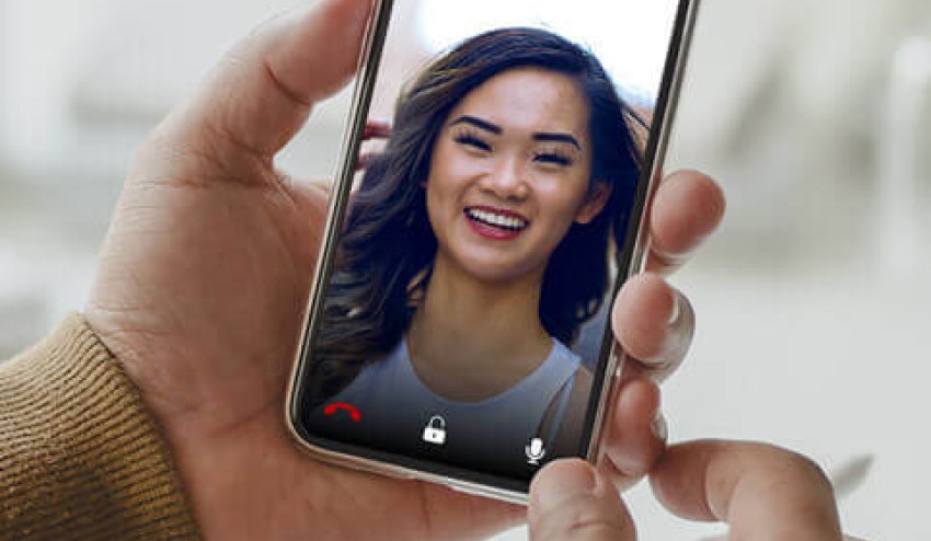 Image showing a man answering a video call from his phone with  user interface options to unlock the door, hang up, and mute the microphone