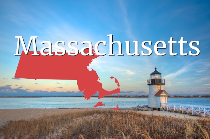 Massachusetts lighthouse and shoreline at sunrise