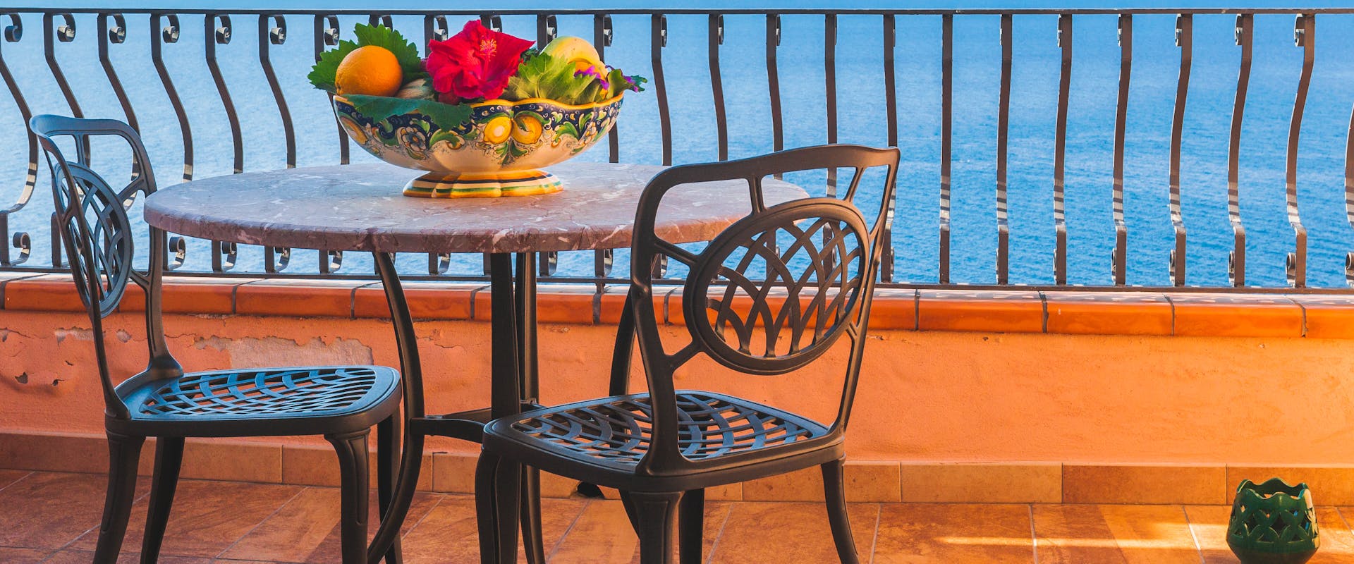 Hotel Chain & Hotel chairs-balcony-flowers-sea-hotel