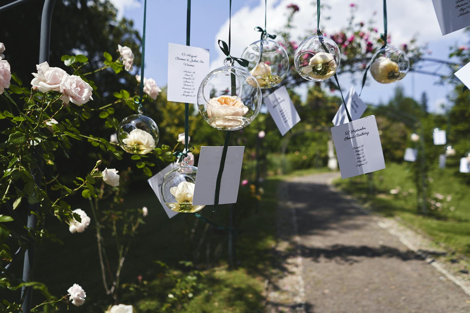 wedding decor on wedding day transparent glass balls with flowers and hanging notes