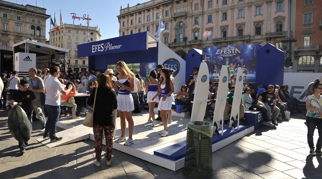 efes pilsener stand in piazza del duomo in milano with hostess