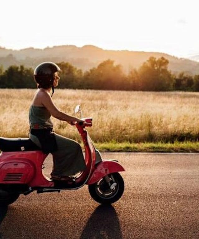 Girl on a Vespa in the Bolognese countryside