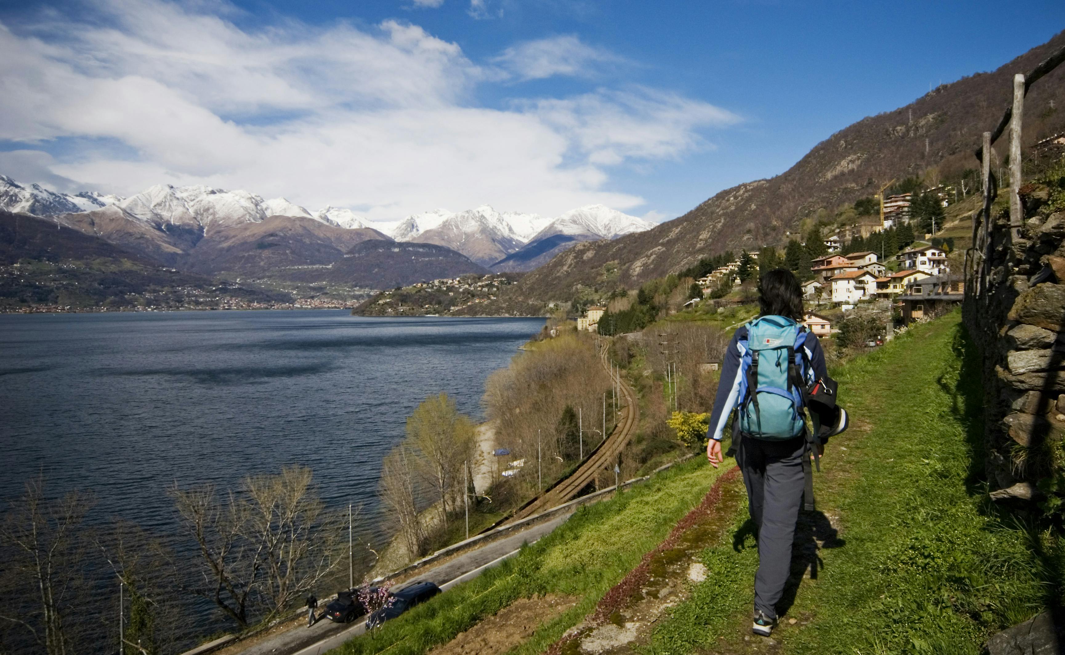 Person walking in front of Lake Como