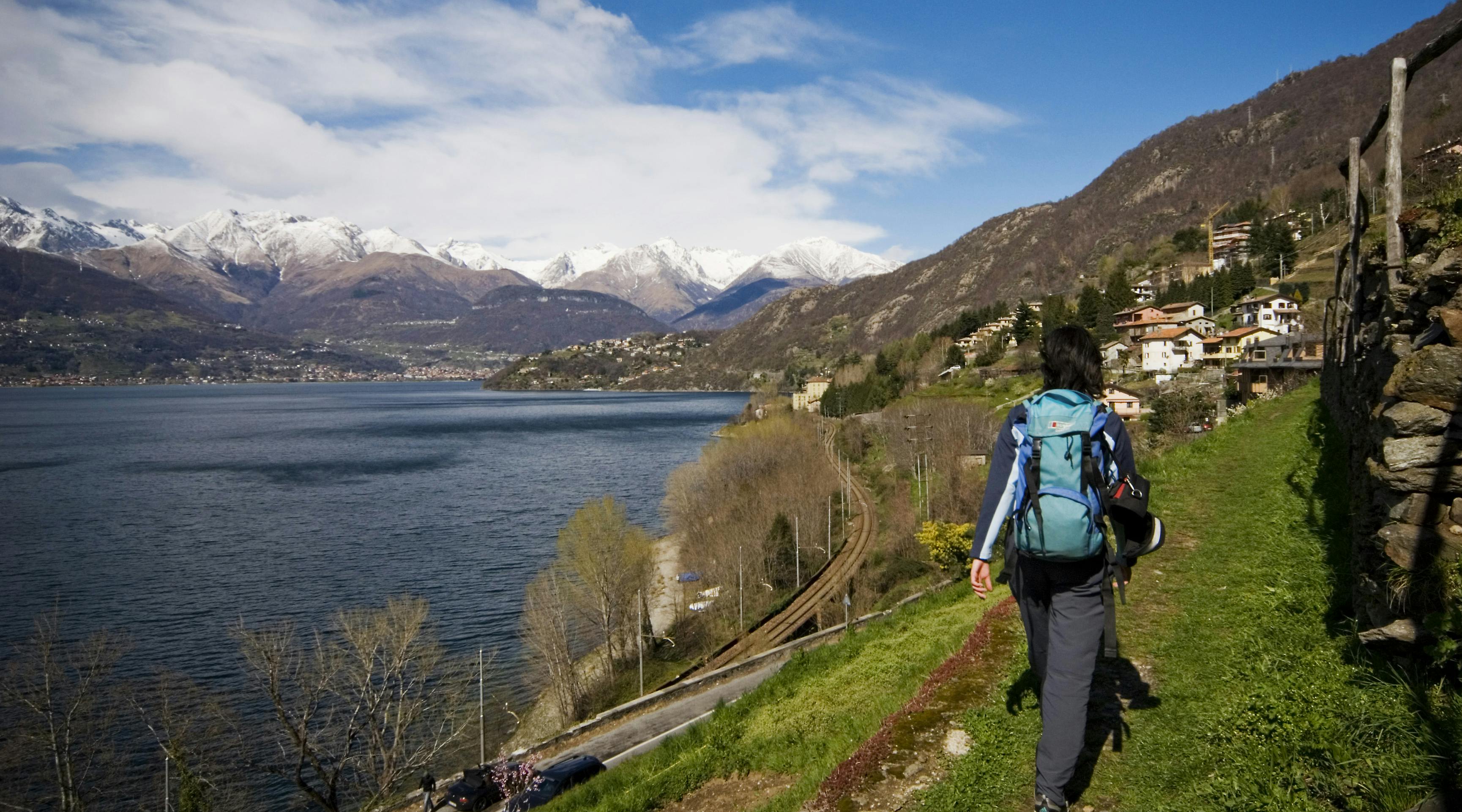 Person walking in front of Lake Como