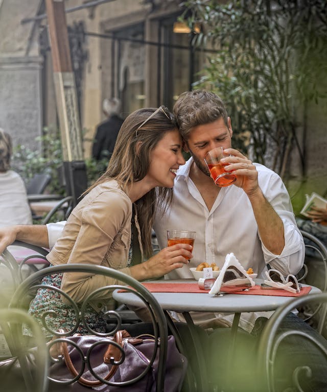 Couple sipping spritz in a Padua bar