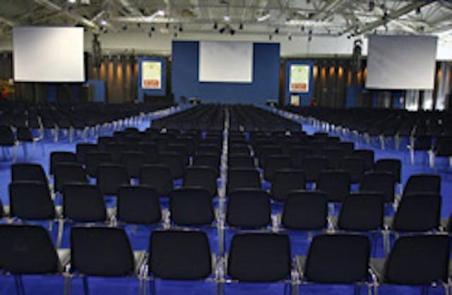 Fiera di Roma meeting room with black chairs and blue floor