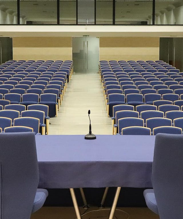 Meeting room with blue table and chairs