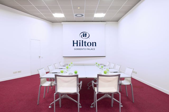 Meeting room with red floor and white walls