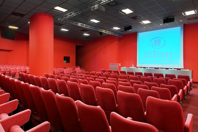 Meeting room with red chairs and red walls