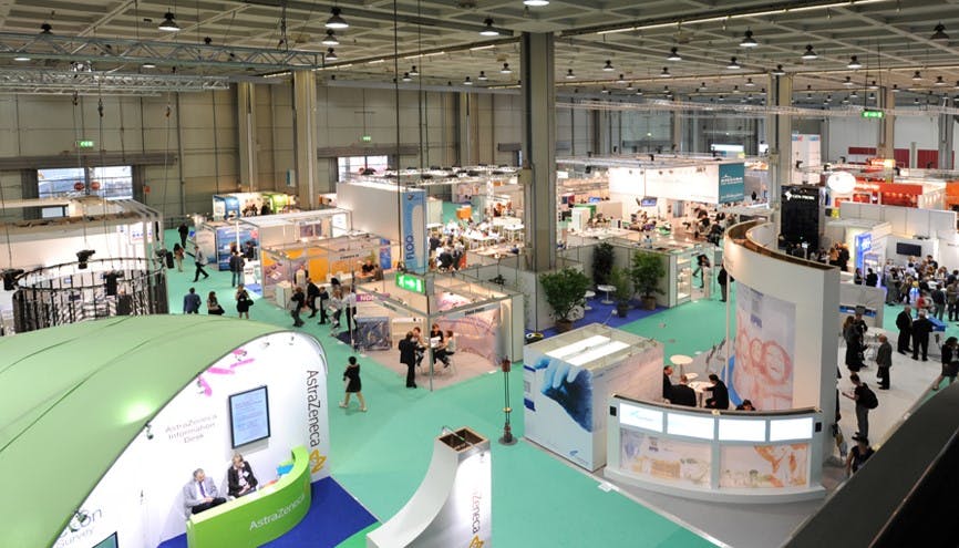 Conference space with stands and many people